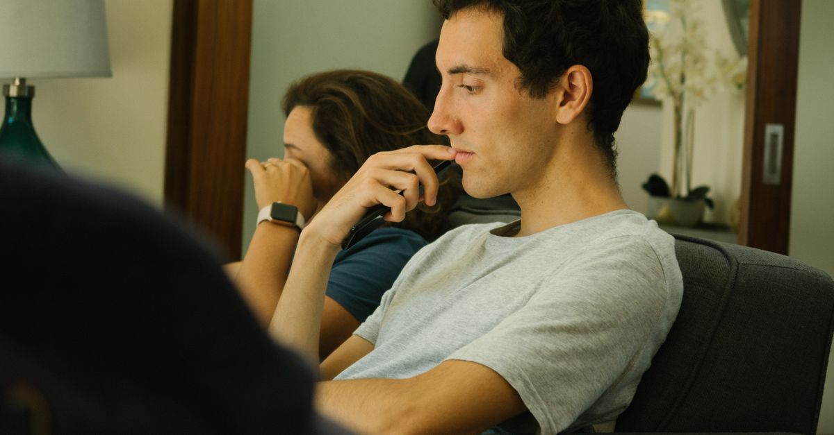 Two people sitting indoors, deep in thought and contemplation.