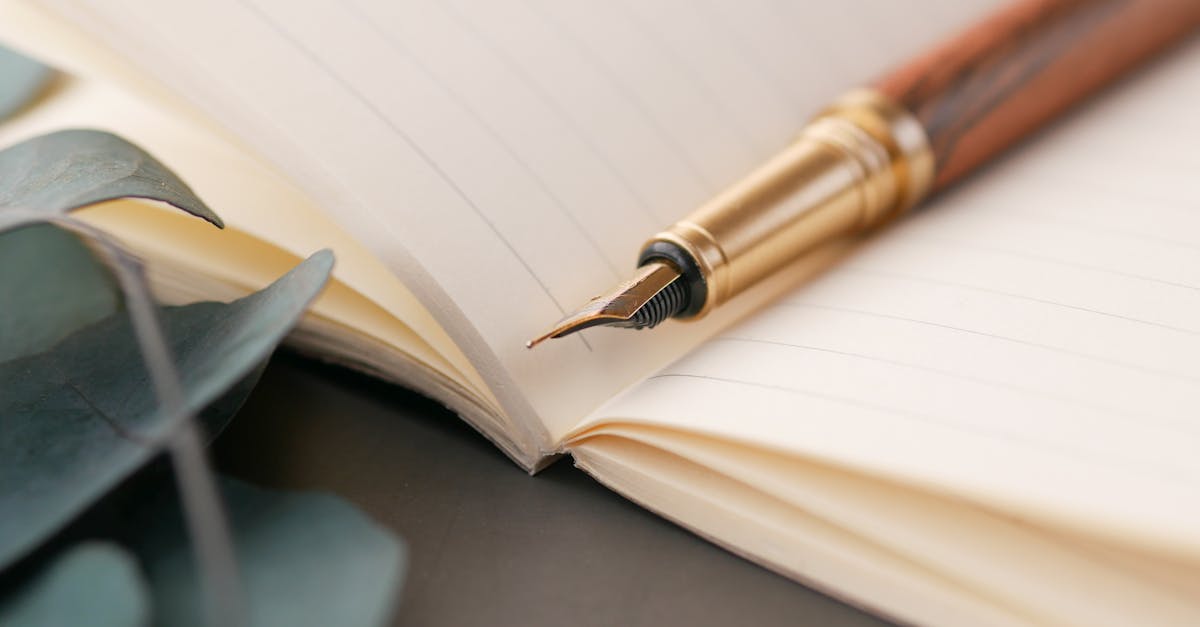 A closeup of a luxurious fountain pen resting on a lined notebook, perfect for writing enthusiasts.